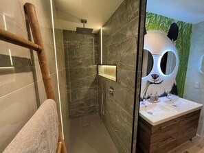 Shower, towels, soap, toilet paper