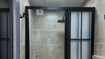 Deluxe Double Room, Courtyard View | Bathroom | Shower, hair dryer, slippers, towels