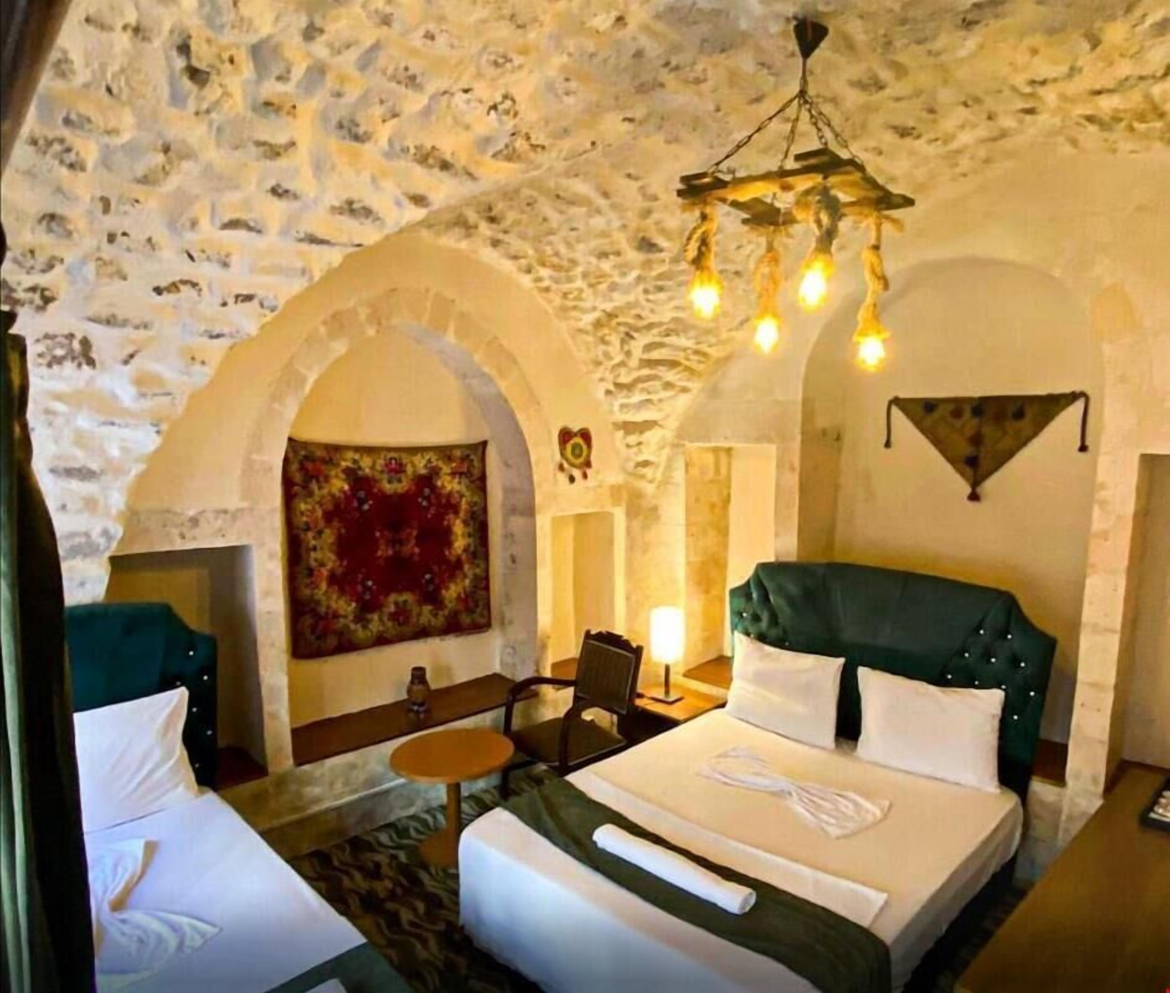 Family Triple Room, Courtyard View | Desk, laptop workspace, soundproofing, iron/ironing board