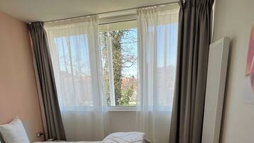 1 bedroom, laptop workspace, iron/ironing board, bed sheets