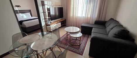 Appartement exécutif, 2 chambres, vue sur la ville | Aire de séjour