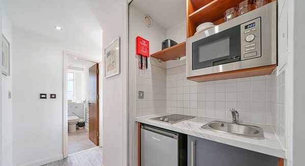 Fridge, electric kettle, cookware/dishes/utensils
