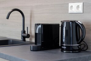 Mini-fridge, microwave, stovetop, cookware/dishes/utensils