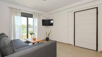 Apartment, 2 Bedrooms, City View | Living area | 42-inch Smart TV with cable channels