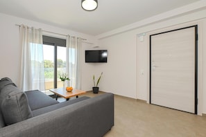 Apartment, 2 Bedrooms, City View | Living area | 42-inch Smart TV with cable channels