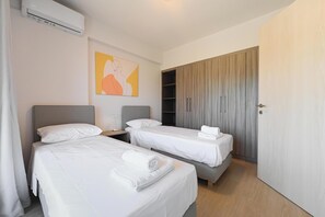 Apartment, 1 Bedroom, City View | Iron/ironing board, free cribs/infant beds, free WiFi, bed sheets