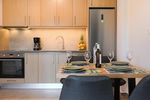 Apartment, 2 Bedrooms, City View | Private kitchen | Full-size fridge, oven, stovetop, coffee/tea maker