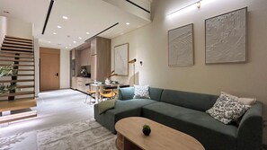 Luxury Penthouse, 1 King Bed, Balcony | Living area | 55-inch Smart TV with cable channels - Stylish 1BR Penthouse in The Autograph  (Dubai)