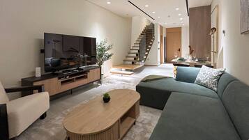 Luxury Penthouse, 1 King Bed, Balcony | Living area | 55-inch Smart TV with cable channels