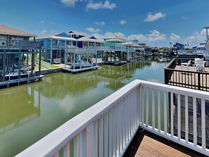 A waterfront property with multiple overwater bungalows connected by walkways.