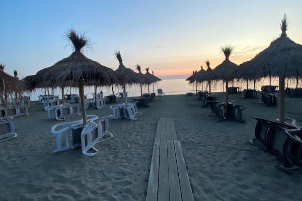 Private beach, sun-loungers, beach umbrellas, beach bar