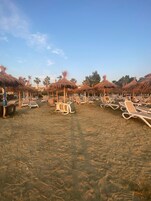 Private beach, sun loungers, beach umbrellas, beach bar