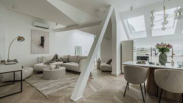 Deluxe Apartment, City View | Living area | 55-inch Smart TV with digital channels