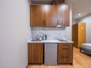 Economy Triple Room | Private kitchen | Mini-fridge - RVR Smart Apartment with Self-check-in (Riga)