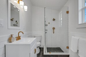 Shower, towels, soap, toilet paper