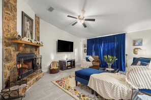 Smart TV, fireplace, books