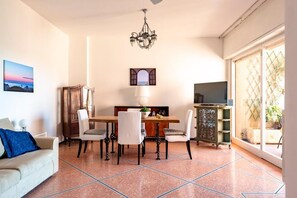 Deluxe Apartment, City View | Living area | 43-inch Smart TV with digital channels