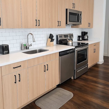 Fridge, microwave, oven, stovetop. Smart Simple and Spacious 4BR Apt