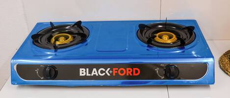 A blue Black+Ford stove with two burners and control knobs.