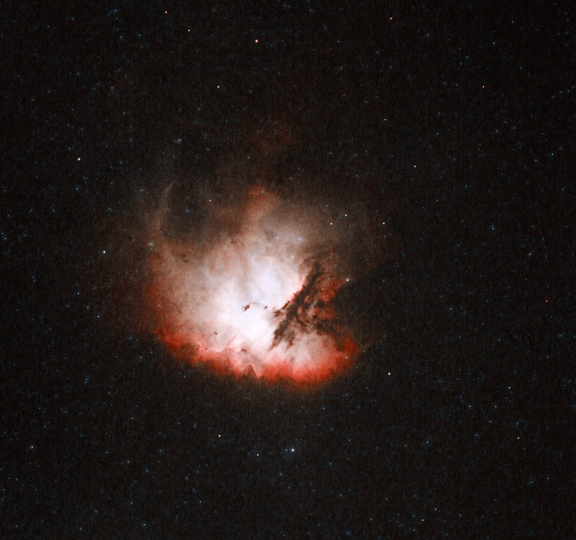 A starry night sky with a prominent nebula.