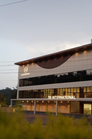 A modern building with a sign reading "SS INTERNATIONAL". - Hotel S S International (Somvarpet)