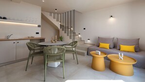 A modern interior with a kitchen, dining area, and living space. - White Orchid Apartments (Santorini)