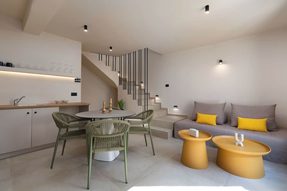 A modern interior with a kitchen, dining area, and living space.
