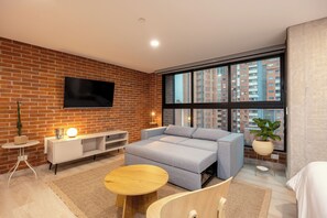 Premium Loft, City View | Living area | Smart TV