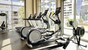 A gym with treadmills, elliptical machines, and a rowing machine. - Tangerine Terrace - 10 min to Disney/Angel Stadium (Orange)