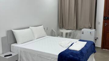Quarto quádruplo superior | Frigobar, roupa de cama