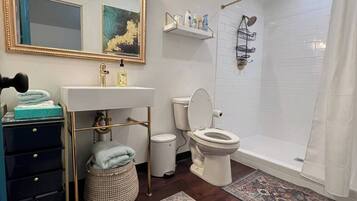 Shower, towels, soap, toilet paper