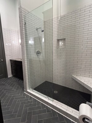 Shower, hair dryer, towels, toilet paper