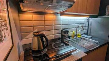 Fridge, microwave, stovetop, coffee/tea maker