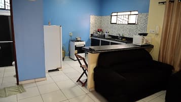 Family Apartment, 1 Bedroom, Balcony, City View | Living area | 32-inch Smart TV with digital channels, Netflix, first-run movies