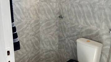 Shower, hair dryer, towels, toilet paper