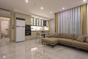Premium Suite | Living area | 43-inch LCD TV with satellite channels
