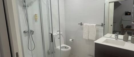 Shower, hair dryer, towels, soap