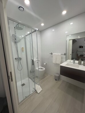 Shower, hair dryer, towels, soap