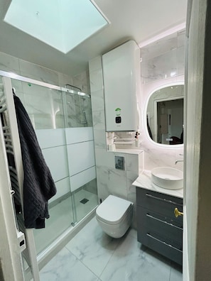 Shower, hair dryer, towels, soap