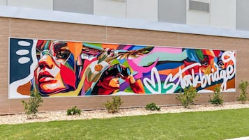 A large outdoor mural on a building's facade.
