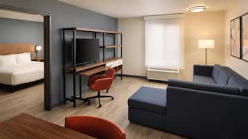Hypo-allergenic bedding, desk, laptop workspace, blackout curtains