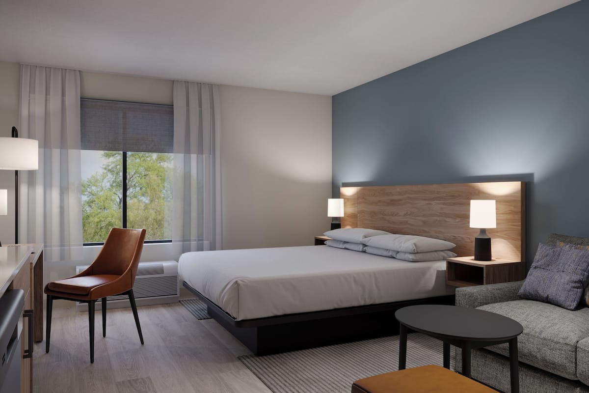 Hypo-allergenic bedding, desk, laptop workspace, blackout curtains