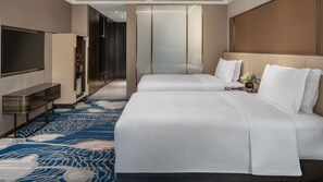 A hotel room with a large bed, a TV, a desk, and a patterned carpet. - Intercontinental Zhengzhou Zhengdong, by IHG (Zhengzhou)