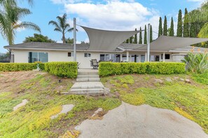 A modern house with a covered patio, a concrete pathway leading to the entrance, and well-maintained greenery. - 2 Mi to Lake Poway: Mtn-View Escape w/ Patio! (Poway)