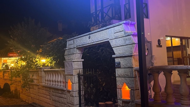 A building with a sign reading "BOVA ROOMS" at night. - Bova Rooms (Kemer)