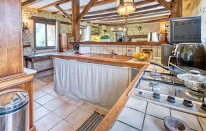 Fridge, stovetop, dishwasher, coffee/tea maker