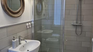 Superior Double Room, City View | Bathroom | Shower, hair dryer, towels, soap