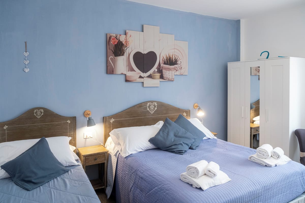 Triple Room, City View | Minibar, in-room safe, free WiFi, bed sheets