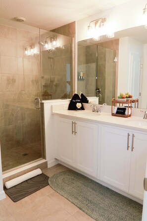 Shower, hair dryer, towels, soap