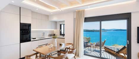 Luxury Duplex, Sea View | Private kitchen | Full-sized fridge, microwave, oven, stovetop